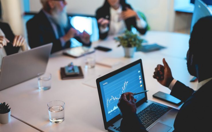 Business trader team doing blockchain analysis inside hedge fund office
