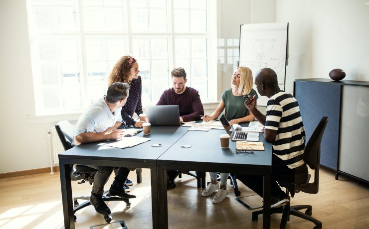 Designers working on a project together in an office