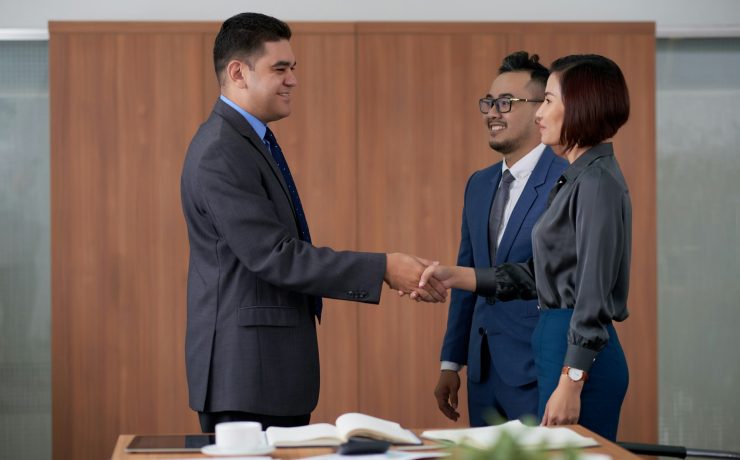 Firm Handshake of International Business Partners